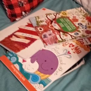 Pile of adult and kid coloring books